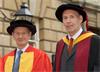 Sir David McMurtry (l) receives Honorary Doctor of Engineering Degree from the University of Bath