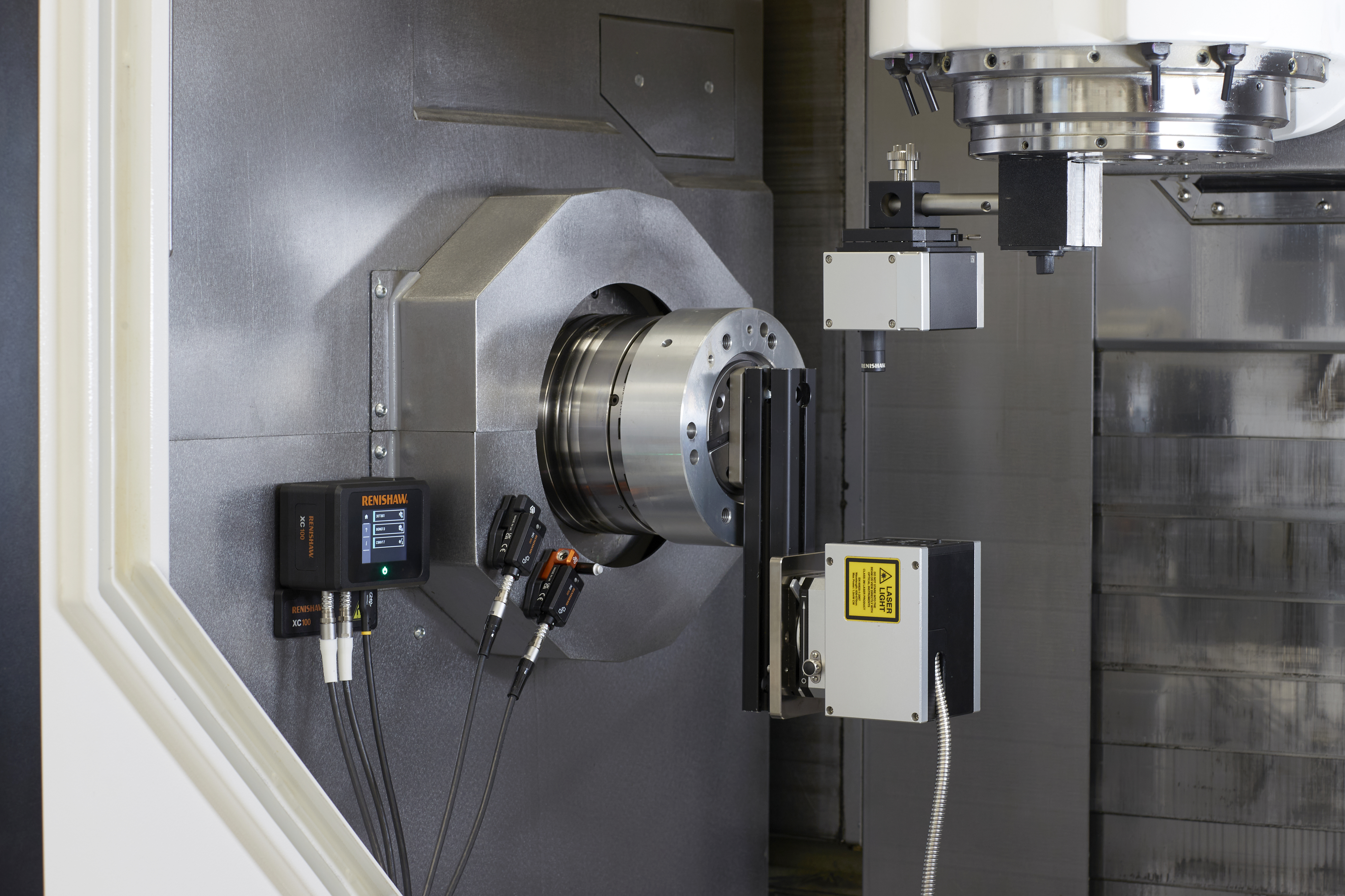 XM-60 calibrator set up within a machine, with the XC100 system performing environmental compensation