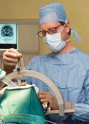 Professor Steven Gill setting up the neuro | guide electrode introducer kit guide tube prior to the Deep Brain Stimulation procedure (jpg)