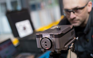 Craig Simpson, Maintenance Technician at FMC Technologies, using the XL-80 laser calibration system to check machine accuracy.