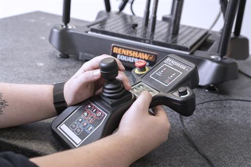 Close up of an engineer at Status Metrology using an Equator system joystick